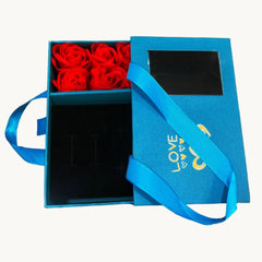 Blue gift box with red roses inside on a white background