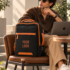 Back of the black Voxtra backpack showing padded straps and breathable mesh panel