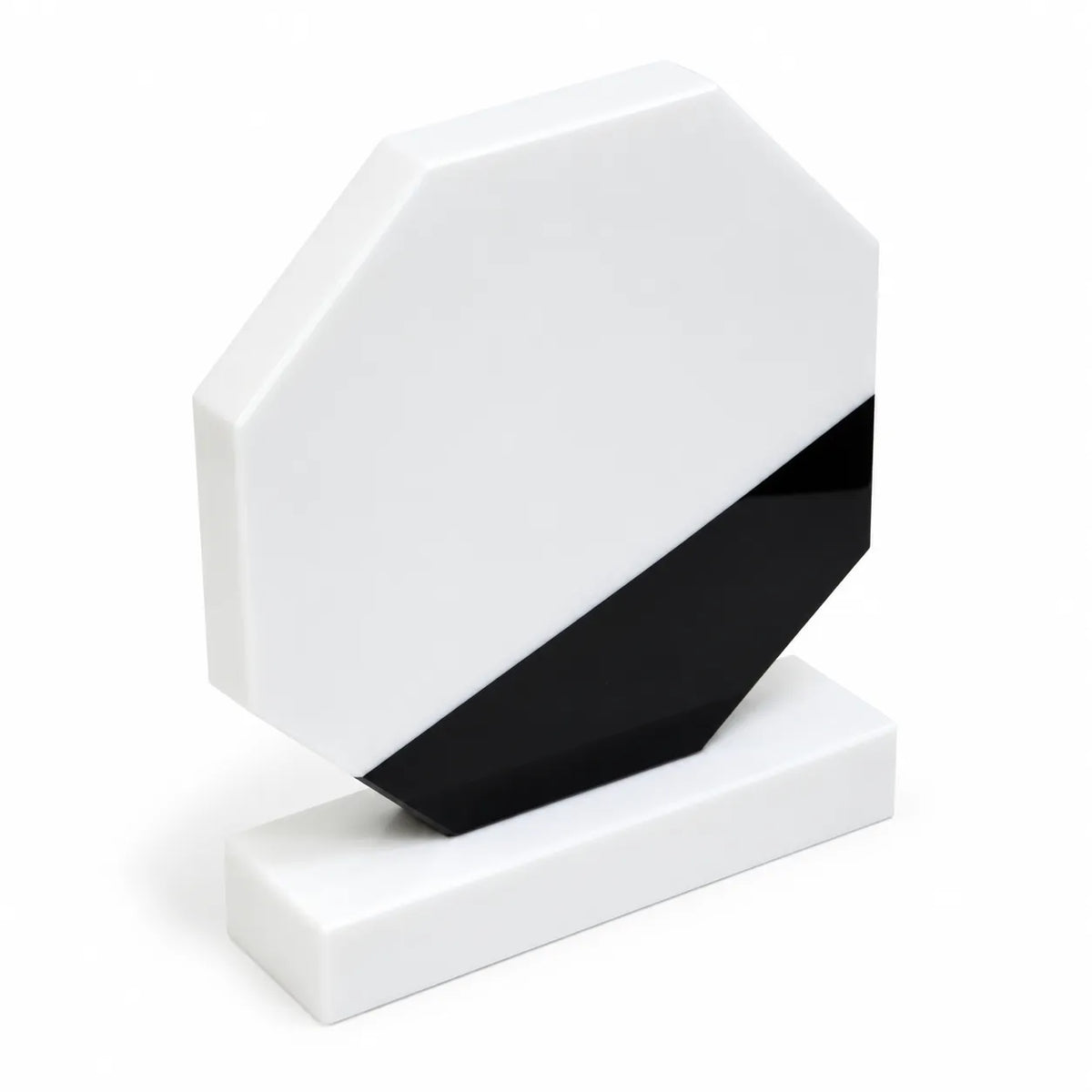 White marble octagonal crystal award on a desk