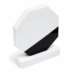 White marble octagonal crystal award on a desk