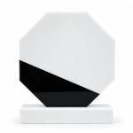 White marble octagonal crystal award on a desk