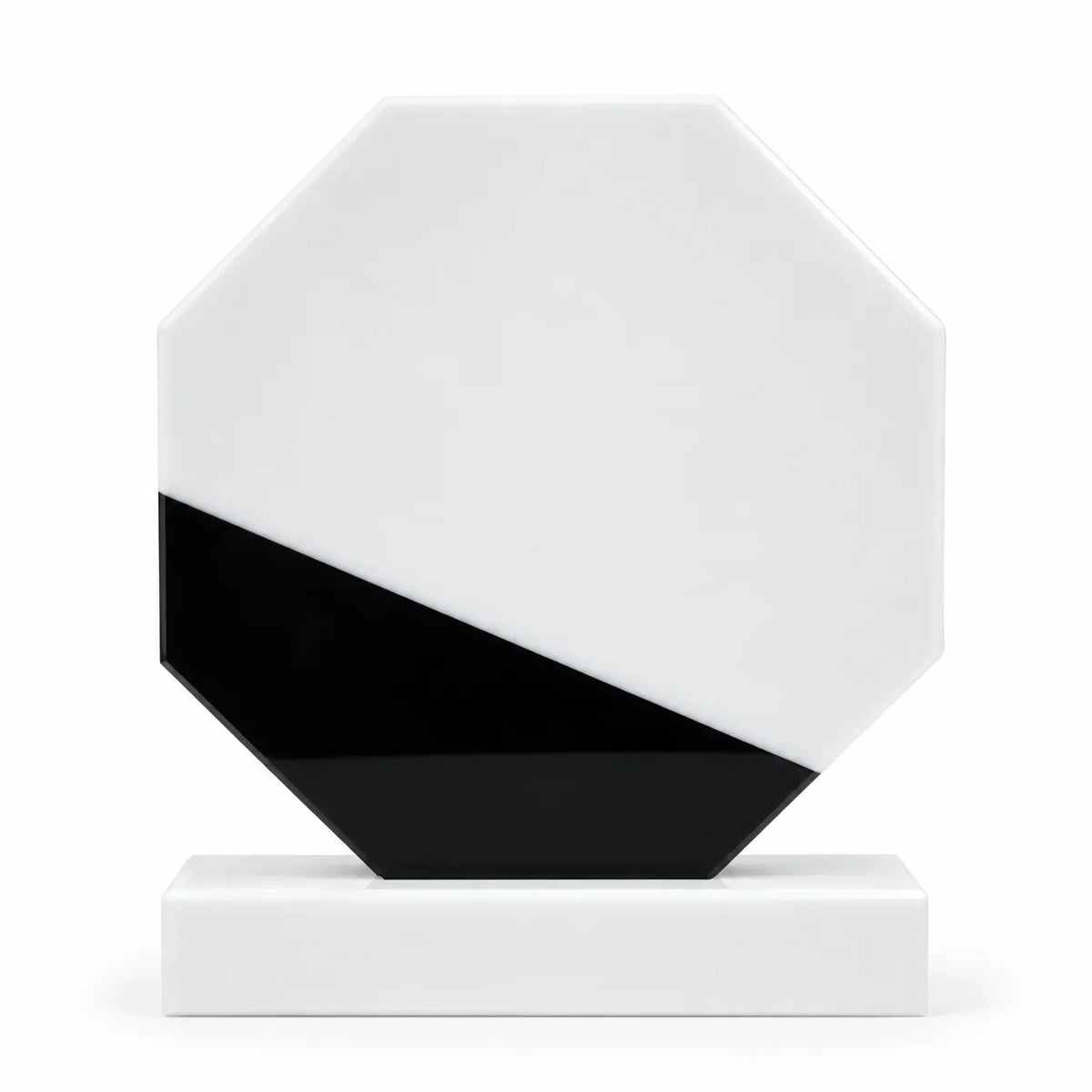 White marble octagonal crystal award on a desk