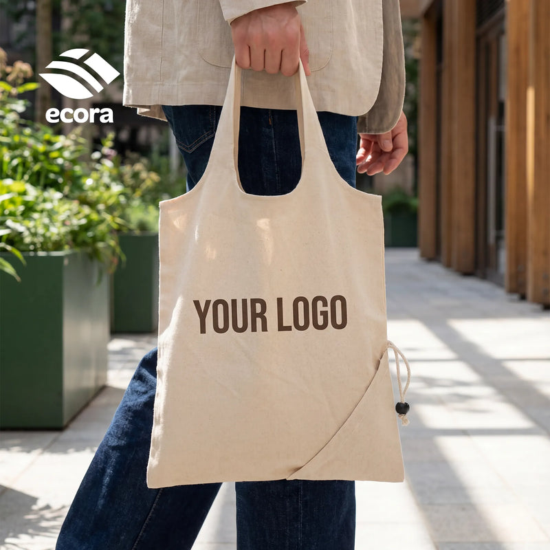 Folva foldable canvas shopping bag opened to full size with the front logo area visible