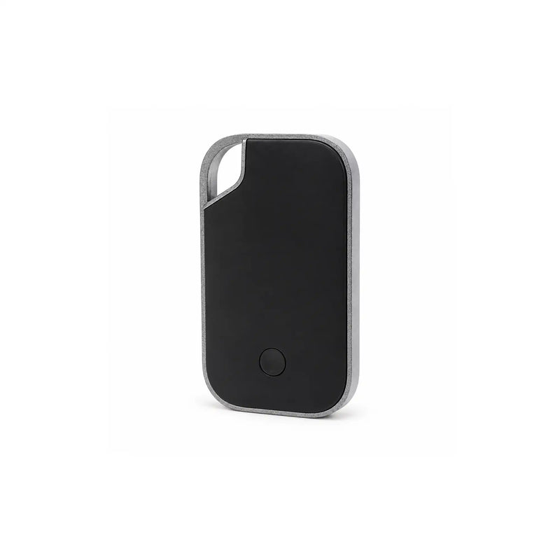 Traxo Bluetooth locator device, black panel with silver metal frame, front view