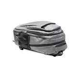 Gray travel backpack with zipper and USB charging feature