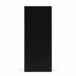 Black geometric faceted crystal award column on a desk