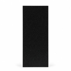 Black geometric faceted crystal award column on a desk