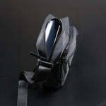 Premium black sling bag with adjustable strap and multi-compartment travel design