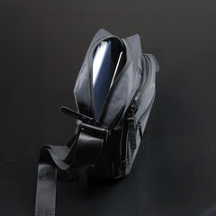 Premium black sling bag with adjustable strap and multi-compartment travel design