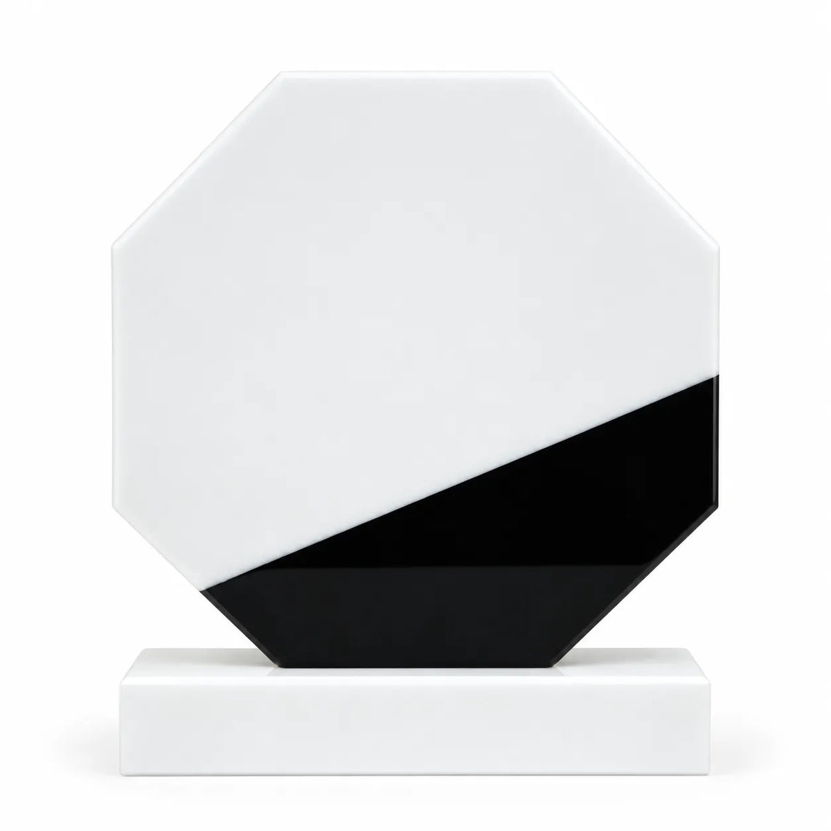 White marble octagonal crystal award on a desk