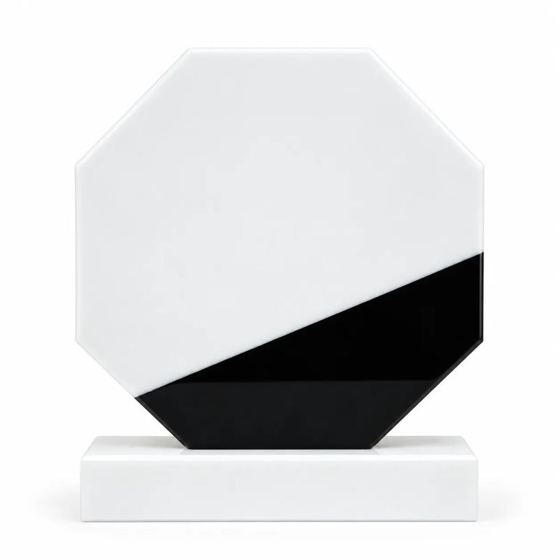 White marble octagonal crystal award on a desk