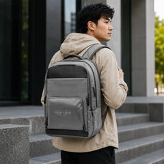 Gray executive laptop backpack with USB charging port and multiple compartments