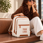 Beige Voxtra travel backpack, front three-quarter view with tan leather trim