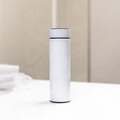 Minimal white stainless-steel smart bottle standing on table