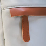 Beige Voxtra travel backpack, front three-quarter view with tan leather trim