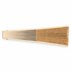 Folding hand fan opened flat showing a speckled natural cork leaf on a pale wooden ribbed frame with a brass pivot