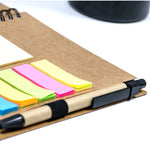 A5 notebook with a pen and sticky notes