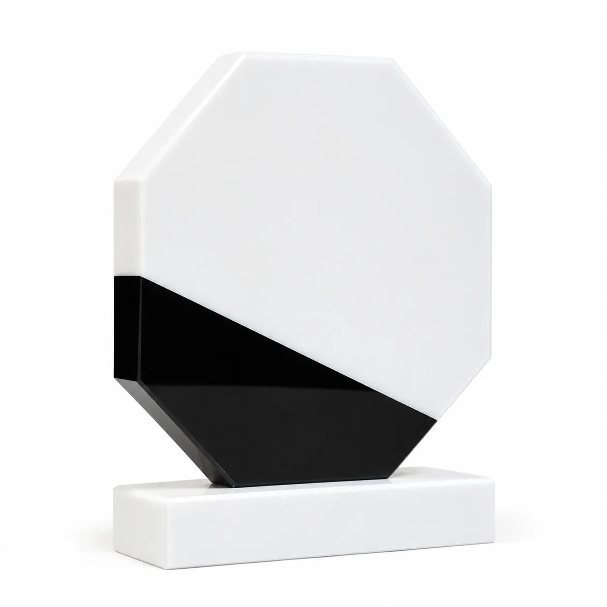 White marble octagonal crystal award on a desk