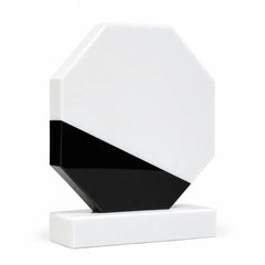 White marble octagonal crystal award on a desk