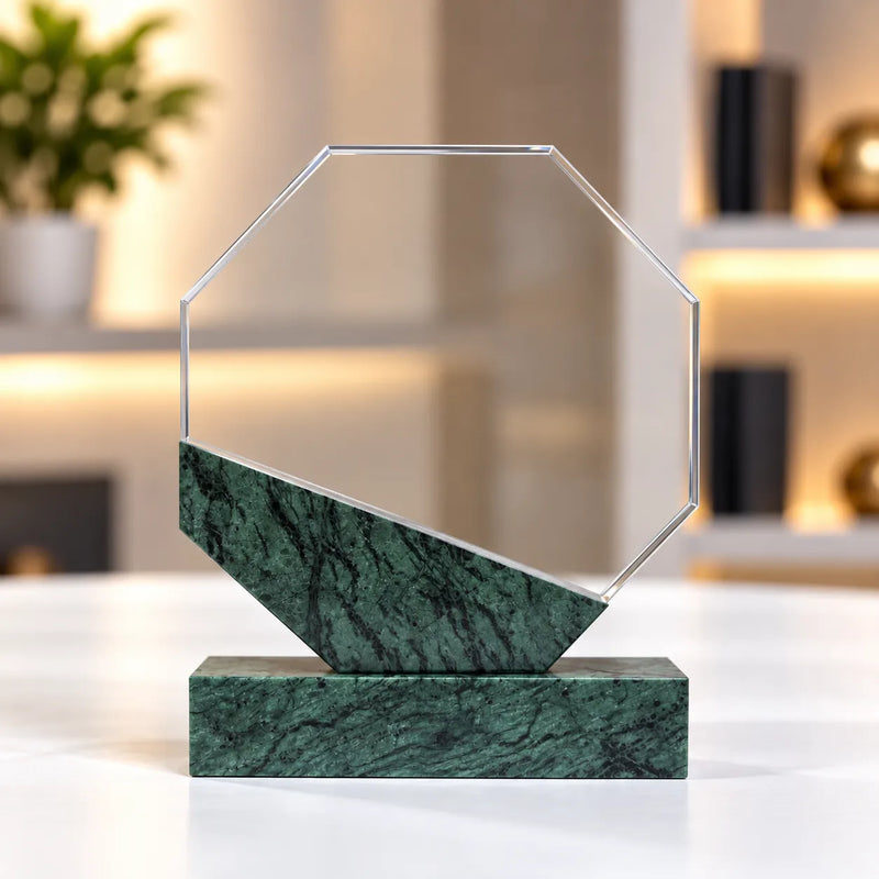 Green marble octagonal crystal award on a desk