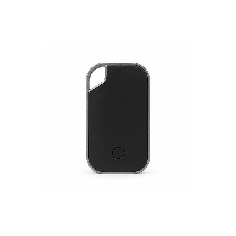 Traxo Bluetooth locator device, black panel with silver metal frame, front view
