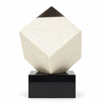 Diamond corner crystal cube on a black base on a desk