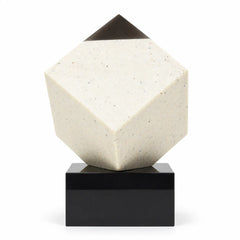 Diamond corner crystal cube on a black base on a desk