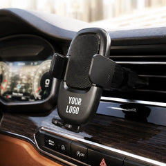 Car mobile holder mounted on an air vent gripping a phone