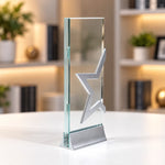 Silver star crystal award column on a desk